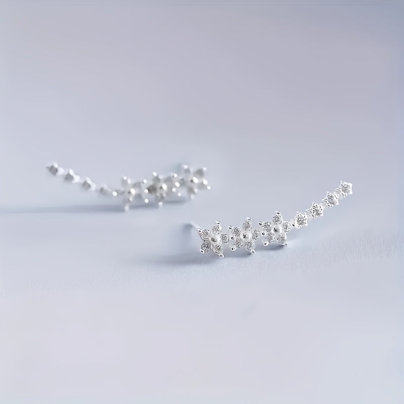 Delicado conjunto de pendientes florales