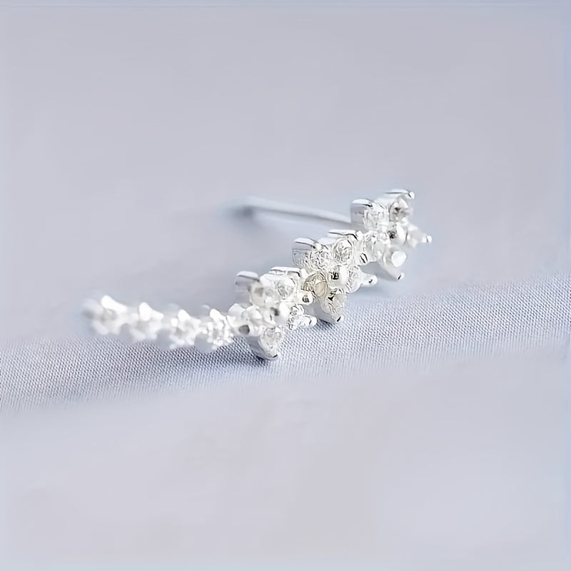 Delicado conjunto de pendientes florales