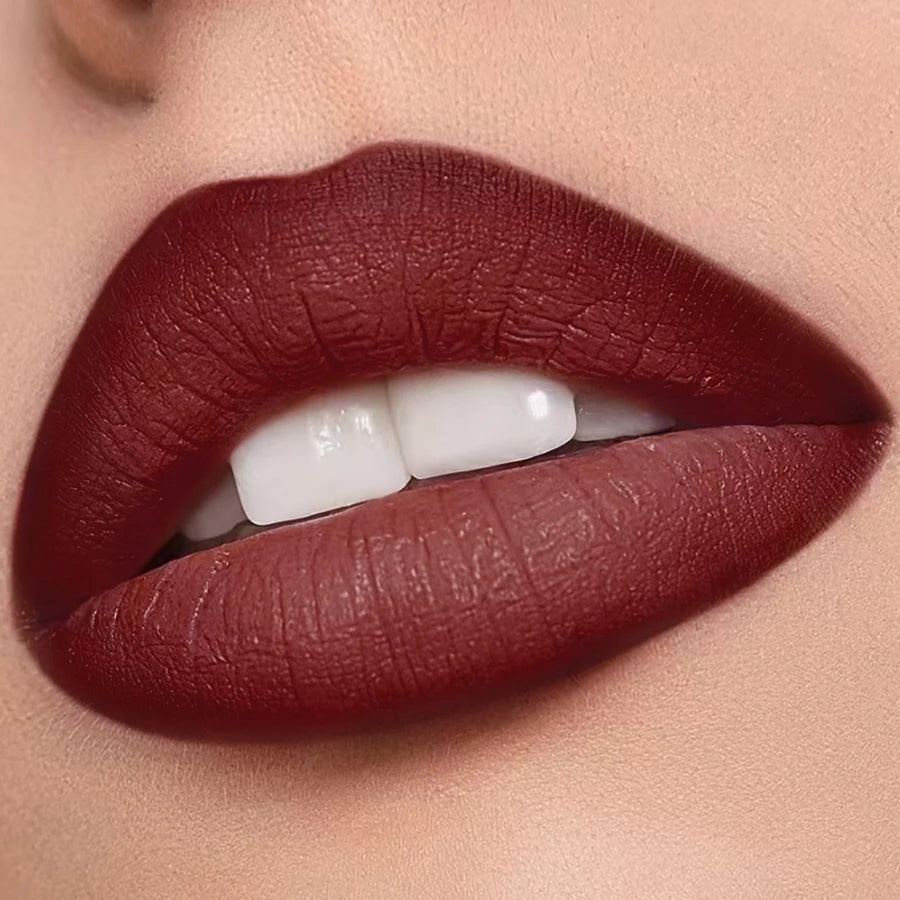 Deep wine red KAFURUX matte lipstick shown on full lips close-up