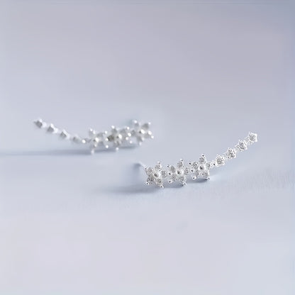 Delicado conjunto de pendientes florales