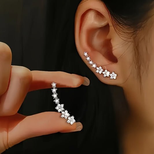 Delicado conjunto de pendientes florales