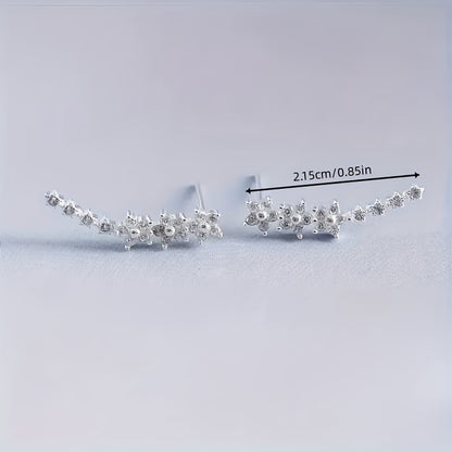 Delicado conjunto de pendientes florales