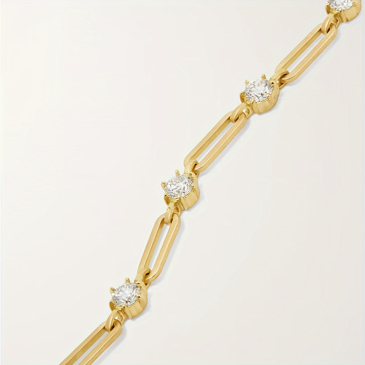 Side profile of round cut moissanite tennis bracelet with four-prong setting