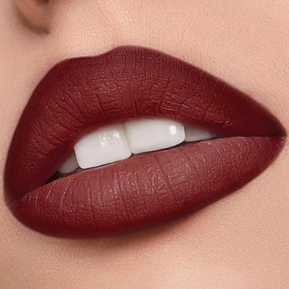Deep wine red KAFURUX matte lipstick shown on full lips close-up