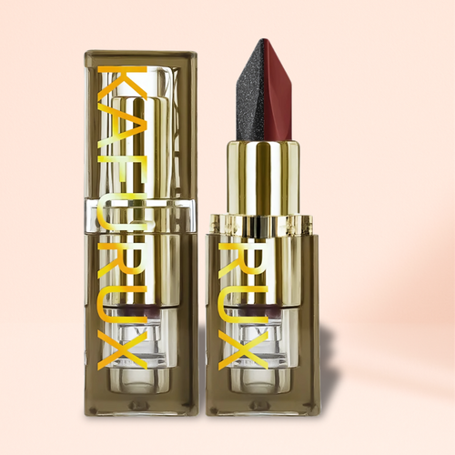 KAFURUX Two-tone black and red lipstick tube in gold case shown on pastel peach background